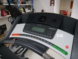 a close up view of a tread machine in a room