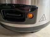 a close up of a crock pot on a table