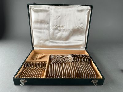 a black case with silverware in it on a table