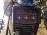 a welding machine with a helmet on top of it