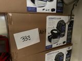three boxes of electronic gadgets sitting on top of each other