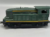 a toy train on a white surface with a white background