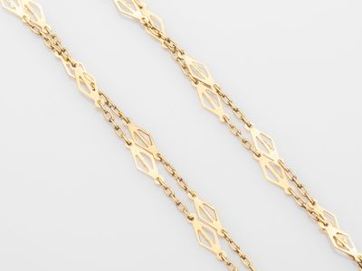 a pair of gold chains on a white background