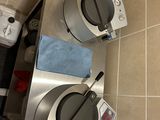 two waffle machines sitting on a counter in a kitchen