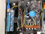 a close up of a computer motherboard with wires and wires
