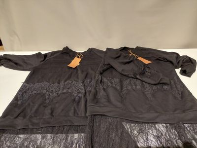 two pieces of clothing are sitting on a white table