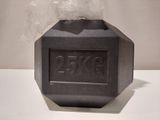 a black object on a white table with a plastic bag
