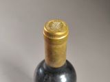a bottle of wine that is sitting on a table