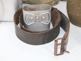 a belt that has a buckle on it on a table