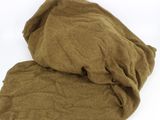 brown blanket on a white surface with a white background