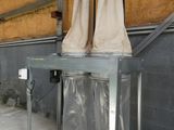 a metal table with two towels hanging on it