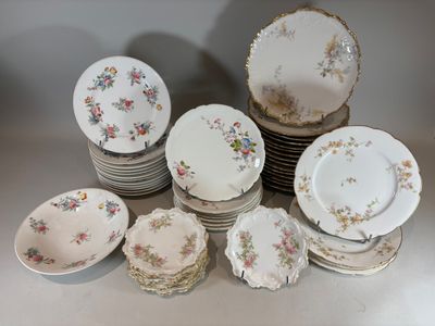 a lot of plates that are sitting on a table