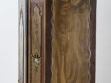 an image of a wooden cabinet with a door open