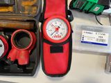 a picture of a tool kit with a watch and other tools