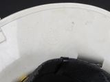 a close up view of a white toilet with a black seat