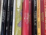 many books that are on a shelf in the room