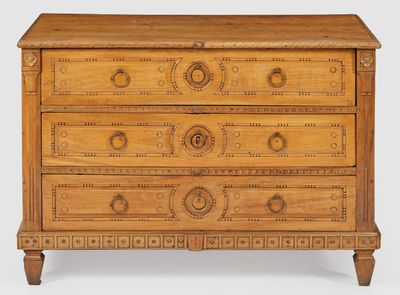 an old wooden chest of drawers with carvings on the drawers