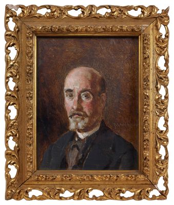 portrait d'un homme en costume-cravate dans un cadre doré