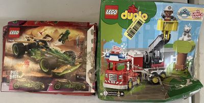 two legos that are sitting on a shelf