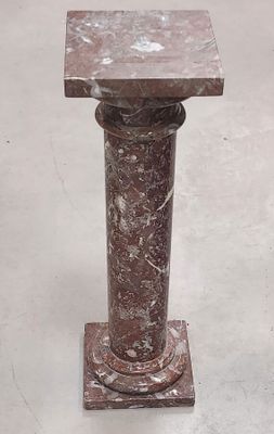 marble pedestal with a square top and a square base