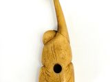 an image of a wooden birdhouse with a bird on it ' s head