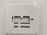 a close up of a white electrical outlet on a wall
