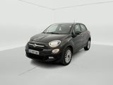 the small black car is parked in a white room