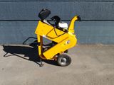 a yellow machine that is sitting on the sidewalk