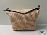 an image of a woven bag sitting on top of a table