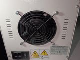 a white machine with a fan on top of it