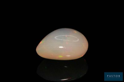 an image of a white oplite on a black surface