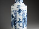 a blue and white vase sitting on a table