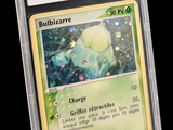 a close up of a pokemon trading card in a plastic holder
