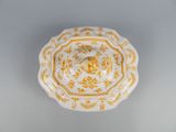 an image of a yellow and white bowl on a table
