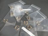 a lot of clear bags with gold rings on them
