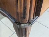 a close up of a piece of furniture that has been damaged