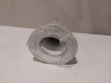 a roll of toilet paper sitting on a white counter