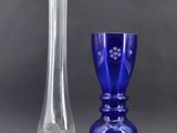 two vases sitting next to each other on a table