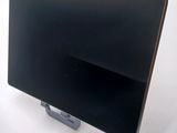 an image of a black laptop computer on a stand