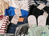 a pile of clothes that is sitting on a table