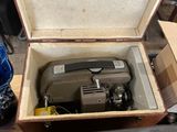 a suitcase with a camera inside of it on a table