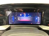 a picture of a car dashboard with a digital display