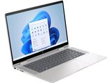 an open laptop computer sitting on top of a white surface