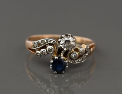 an image of a diamond and sapphire ring