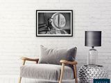 black and white photograph of a chair and a lamp in a room