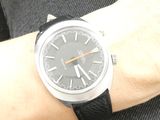 a man that is wearing a watch on his wrist