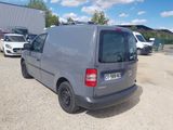 a grey van that is parked in a parking lot