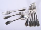 a lot of spoons and forks on the table
