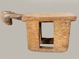 a small wooden object with a handle on top of it