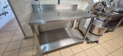 a stainless steel table in a commercial kitchen